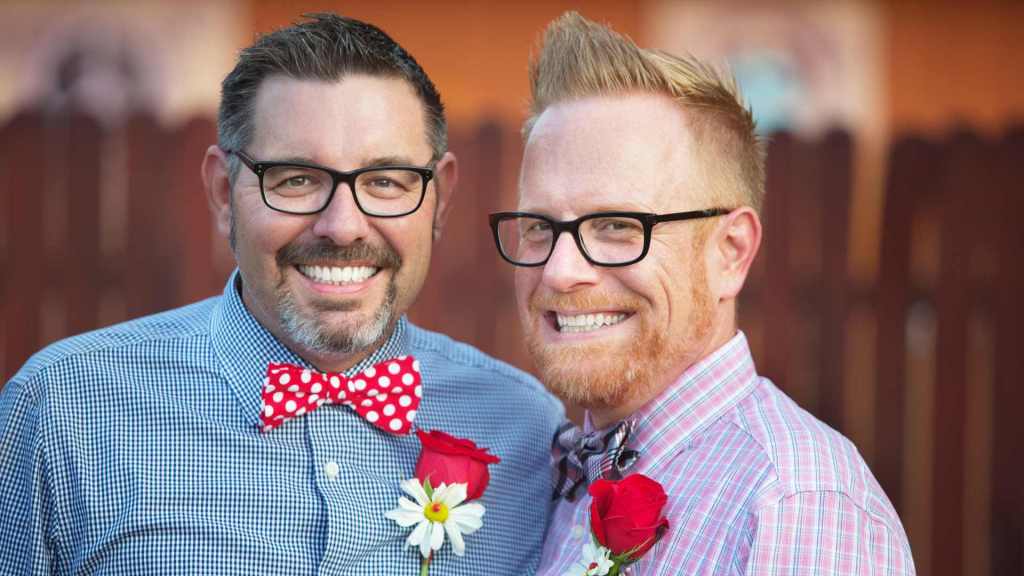 Two LGBT gay men looking happy; symbolizing how to fix your relationship with couples therapy intensive or a couples therapy retreat.